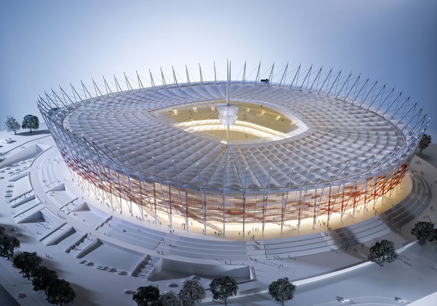 Firmy przenoszą się z biur do tzw. skyboksów na stadionach. Tam zapraszają klientów i omawiają szczegóły kontraktów. W ciągu roku liczba takich skyboksów w Polsce może się podwoić. Dla dużych firm to inwestycja w wizerunek, na zdjęciu makieta Stadionu Narodowego w Warszawie Źródło: NCS.