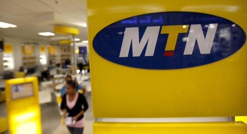 A customer leaves an MTN shop in Johannesburg April 10, 2012.    REUTERS/Siphiwe Sibeko