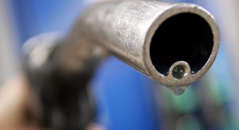 A motorist holds a fuel pump at a Gulf petrol station in London,  file. REUTERS/Luke MacGregor/File Photo