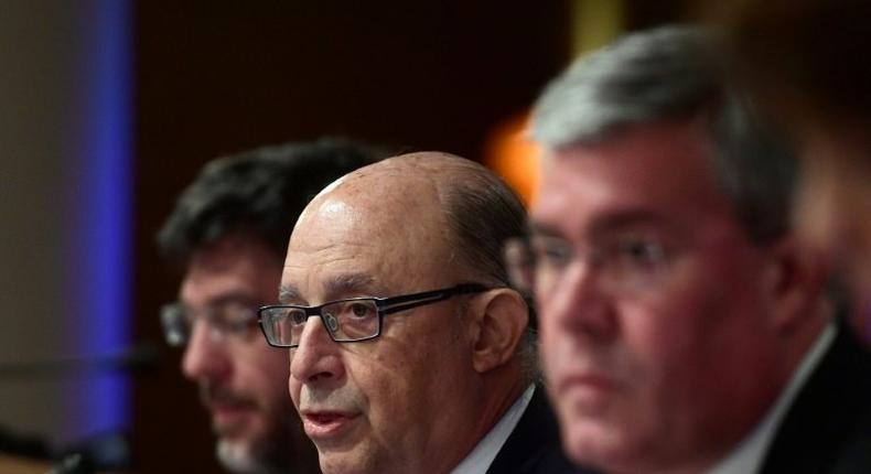 Minister of Finance and Public Services, Cristobal Montoro (C) gives a press conference to inform about 2016 budget in Madrid, on March 30, 2017