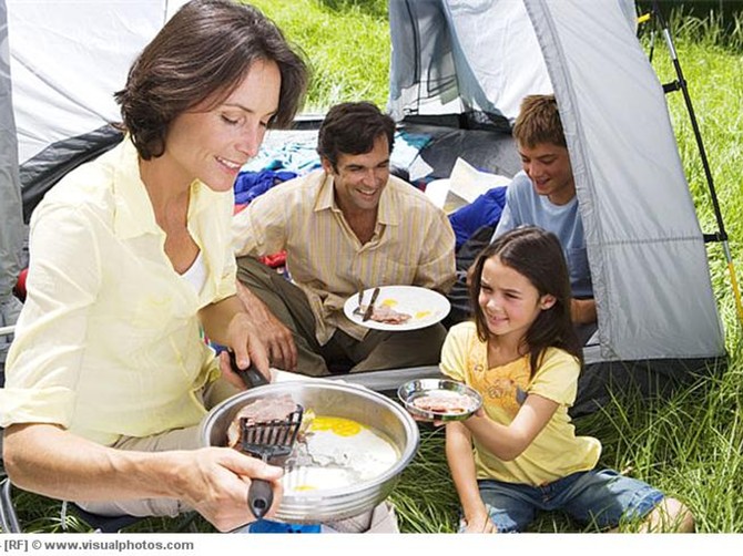 17451_family_eating_fried_breakfast_on_camping_trip_5784