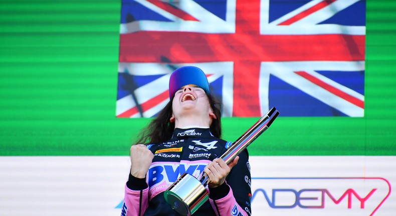 Abbi Pulling of Rodin Motorsport on the podium after winning an F1 Academy race.James Sutton - Formula 1/Getty Images