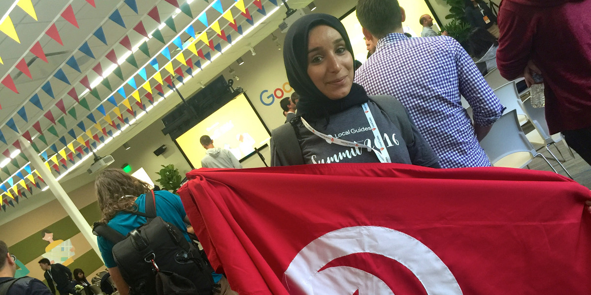 Houda Rouaissi poses with the Tunisian flag