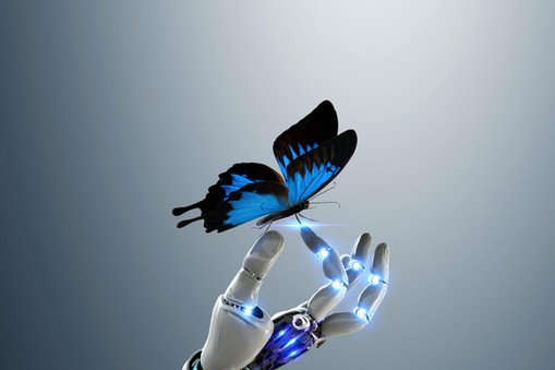 Robot hand holding butterfly