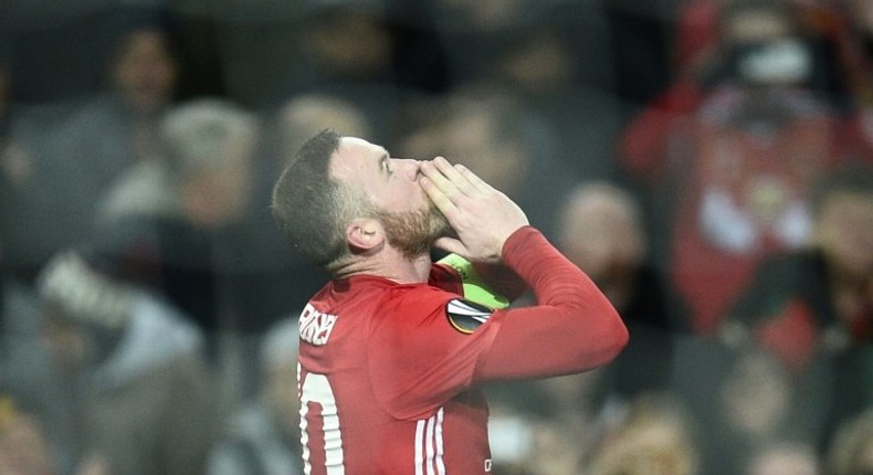 Manchester United's English striker Wayne Rooney celebrates scoring the opening goal against Feyenoord at Old Trafford stadium in Manchester, north-west England, on November 24, 2016