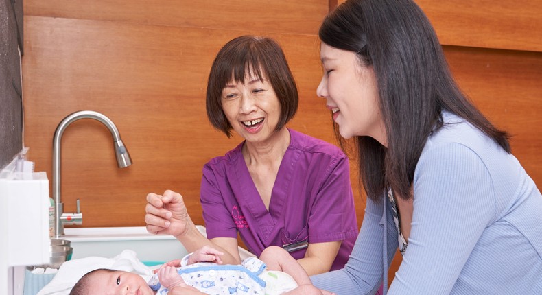 A nurse giving tips to a new mom.Courtesy of My Queen