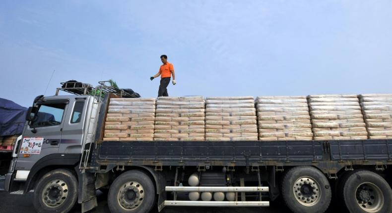 A South Korean driver checks sacks of flour bound for North Korea before crossing the inter-Korean border in Paju, north of Seoul