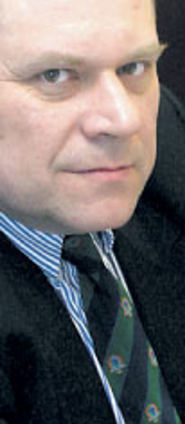 dr Janusz Fiszer, partner White & Case, docent UW