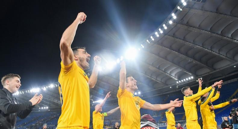 Roman conquerors: Celtic players celebrate a 2-1 win over Lazio in the Italian capital