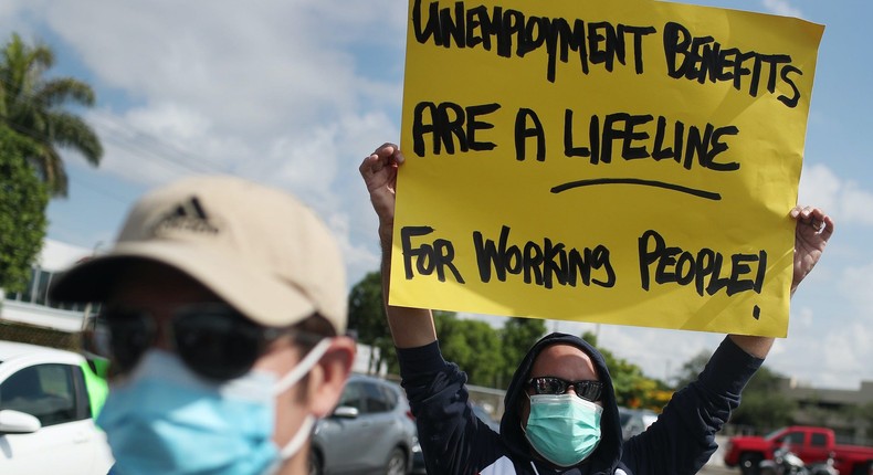 Carlos Ponce joins a protest in  in Miami Springs, Florida, asking senators to continue unemployment benefits past July 31, 2020.