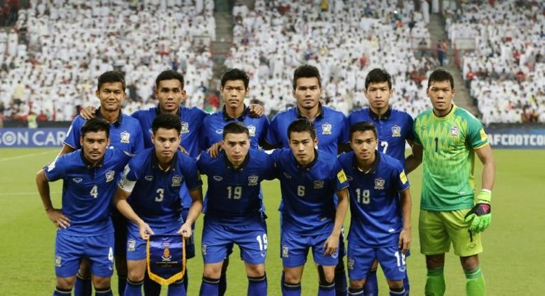 Thailand's starting eleven pose for a group picture ahead of their 2018 FIFA World Cup qualifying match against United Arab Emirates, at the Mohammed Bin Zayed Stadium in Abu Dhabi, on October 6, 2016