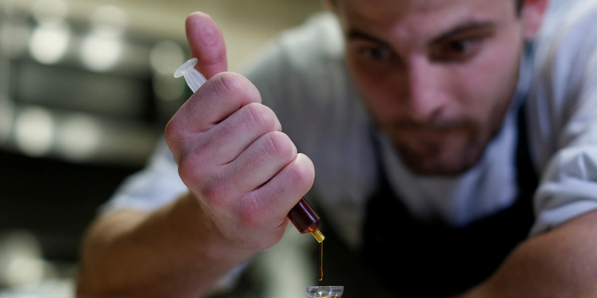 Chef Christopher Sayegh weighs a marijuana extract oil in his kitchen in Los Angeles, California.