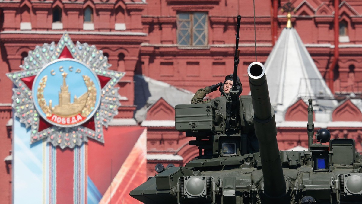 Russian servicemen drive T-90A main battle tank during Victory Day parade to mark end of World War T