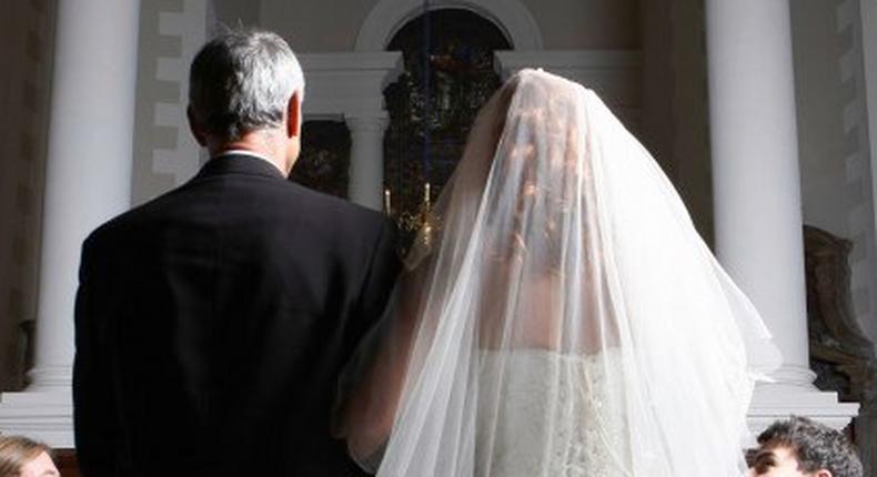 Father walking his daughter down the aisle