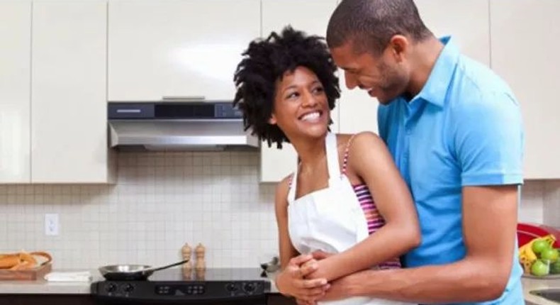 Happy couple cooking together