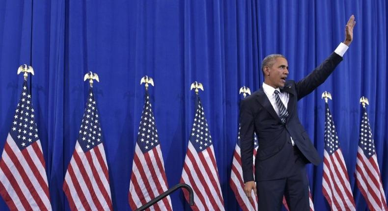 US President Barack Obama waves after speaking on counterterrorism in Tampa, Florida on December 6, 2016