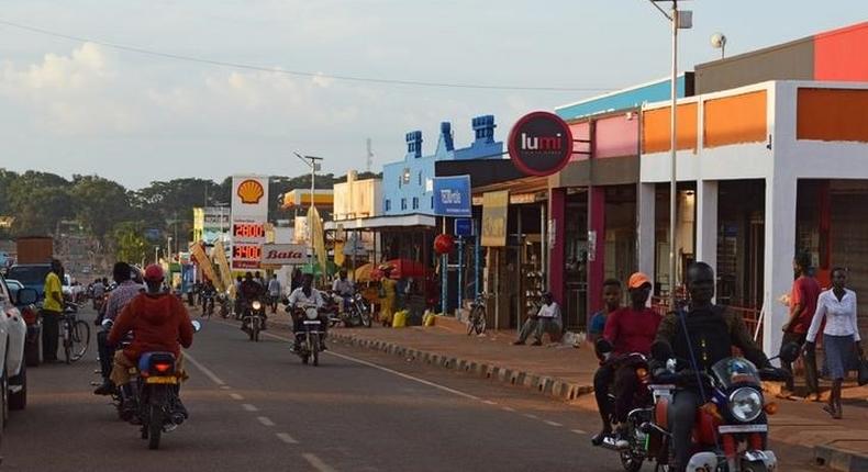 Motorbike taxis ride along a street where Alfred Olango's family once lived in Gulu, Uganda September 29, 2016. 