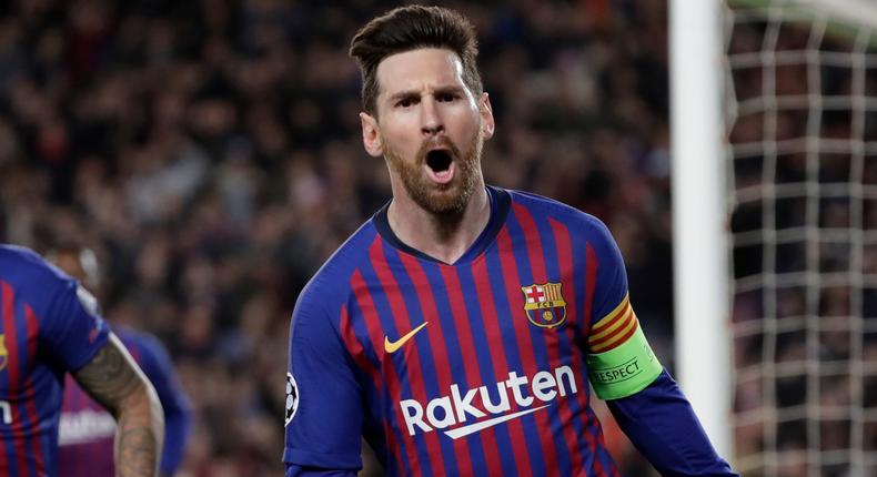 Barcelona's Lionel Messi, right, celebrates after scoring his side's third goal during the Champions League round of 16, 2nd leg, soccer match between FC Barcelona and Olympique Lyon at the Camp Nou stadium in Barcelona, Spain, Wednesday, March 13, 2019. (AP Photo/Emilio Morenatti)