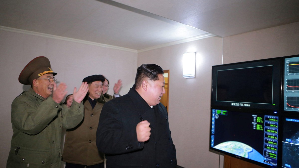 North Korea's leader Kim Jong Un is seen as the newly developed intercontinental ballistic rocket Hw