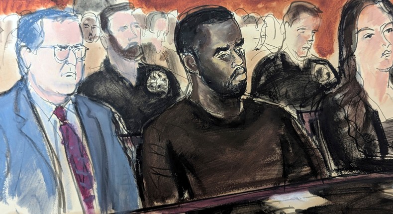 In this courtroom sketch, Sean Combs, center, sits alongside his defense attorneys in Manhattan federal court.Elizabeth Williams via AP