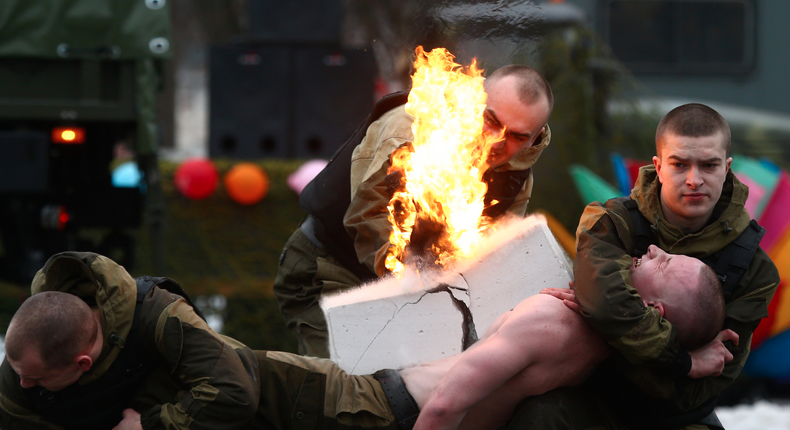 Members of the Belarussian Interior Ministry's special forces unit performing at celebrations for Maslenitsa, a pagan holiday marking the end of winter celebrated with pancake eating and shows of strength, at their base in Minsk, Belarus.