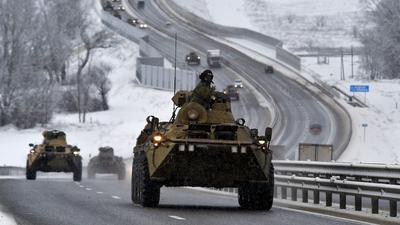 A convoy of Russian armored vehicles moves along a highway in Crimea on January 18, 2022.