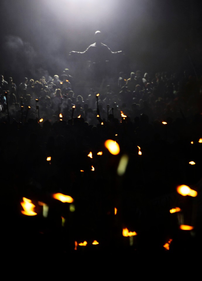 Thousands of members from the UJC and student organizations participate in a torch march in celebration of the 158th birth anniversary of Cuba's independence hero Jose Marti, in Havana