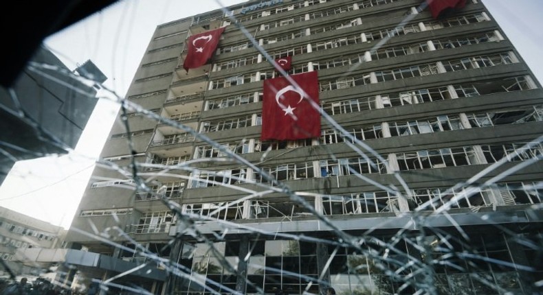 Turkish flags hang from the facade of the damaged Ankara police headquarters after it was bombed during the failed July 15 coup attempt, in a picture taken on July 19, 2016