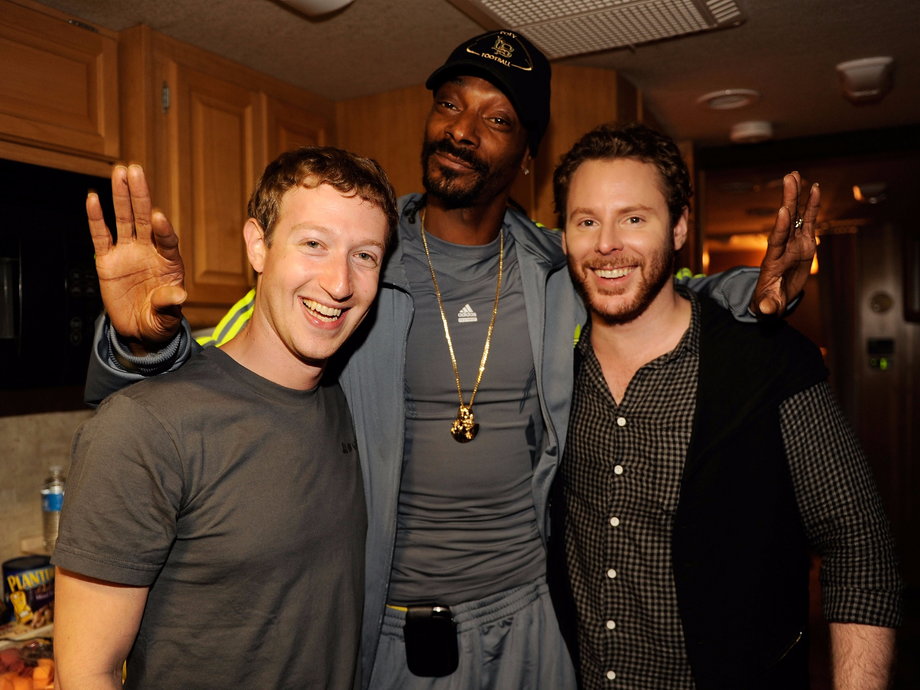 Sean Parker stands alongside Facebook founder Mark Zuckerberg and rapper Snoop Dogg at an event in 2011.