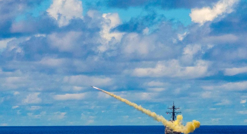 FILE PHOTO: The US Navy guided missile destroyer USS Curtis Wilbur launches a Harpoon surface-to-surface missile during Pacific Vanguard (PACVAN) quadrilateral exercises between Australia, Japan, Republic of Korea, and U.S. Naval forces in the Philippine Sea May 26, 2019.