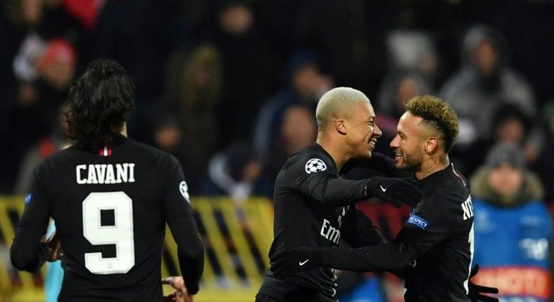 Paris Saint-Germain attacking trio Neymar, Kylian Mbappe and Edinson Cavani all scored as PSG topped Champions League Group C and qualified for the last 16