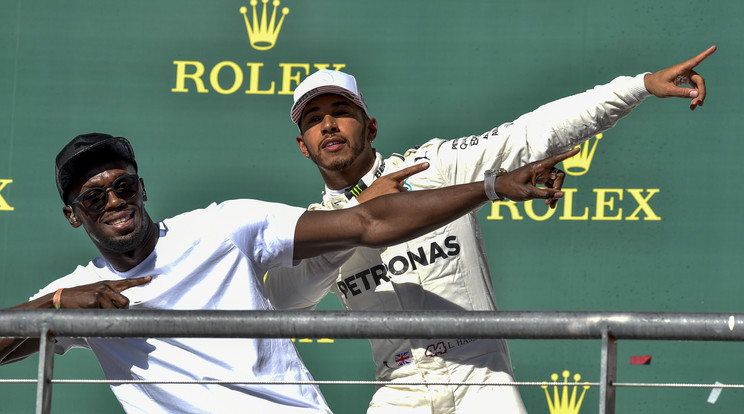 Bolt és Hamilton a verseny után is remekül szórakoztak /Fotó: AFP 