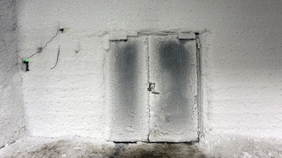 An ice covered entrance door to the international gene bank Svalbard Global Seed Vault near Longyearbyen on Spitsbergen