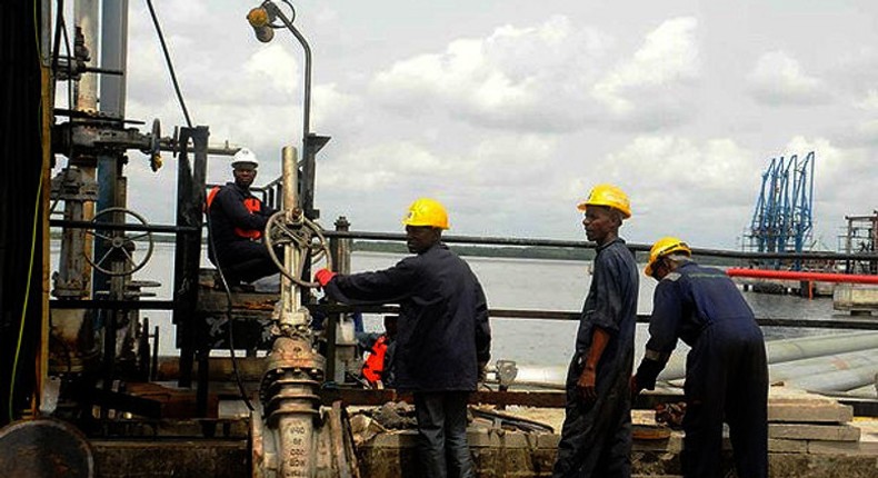 Workers at an oil field