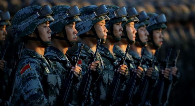 Soldiers of China's People Liberation Army (PLA) take part in a military parade at Tiananmen Square in Beijing on September 3, 2015