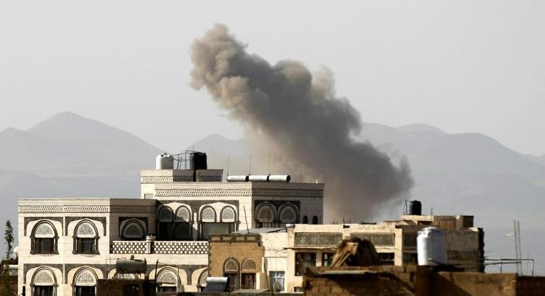 Smoke billows from buildings following a reported air strike carried out by the Saudi-led coalition in the Yemeni capital Sanaa on October 5, 2016