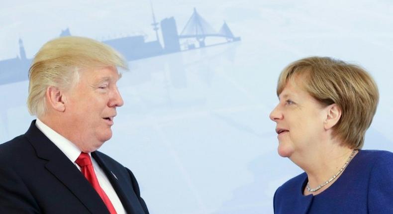 German Chancellor Angela Merkel (R) and US President Donald Trump pose for a photo prior to a bilateral meeting on the eve of the G20 summit in Hamburg, northern Germany, on July 6, 2017