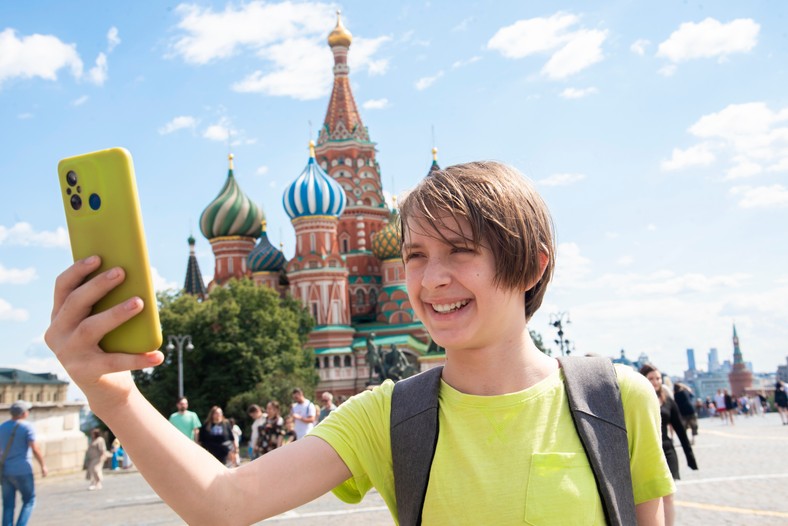 Boy,Holding,A,Phone,,Communicating,,Taking,A,Selfie,In,Front