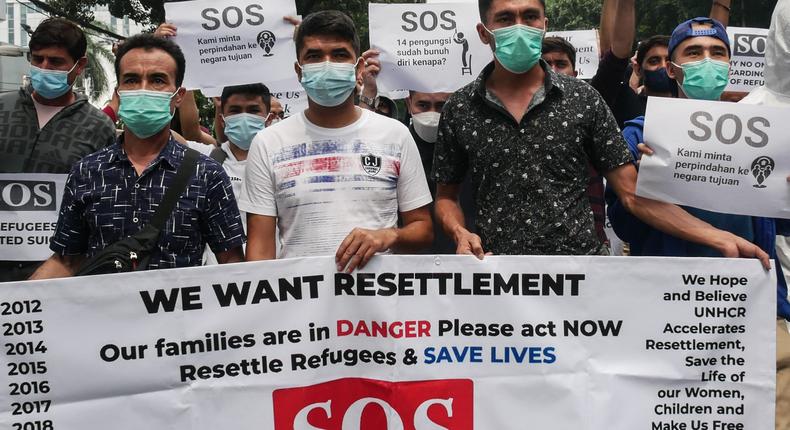 Afghan refugees hold protests outside the United Nations High Commissioner for Refugees in Jakarta, Indonesia on October 4, 2021. They called for resettlement to another country.
