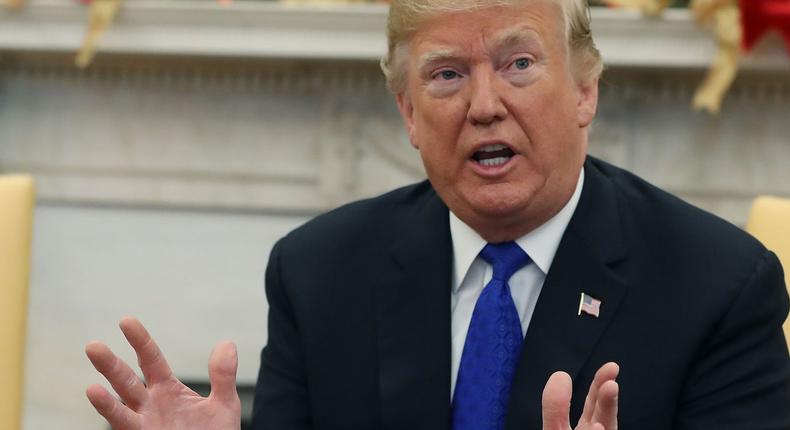 President Donald Trump speaks about border security with House Minority Leader Nancy Pelosi in the Oval Office on Tuesday.