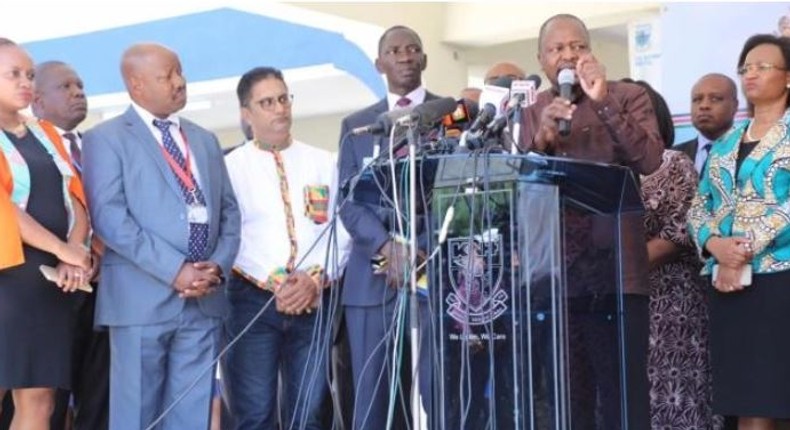 File image of Health CS Mutahi Kagwe addressig the press flanked by other senior government officials 