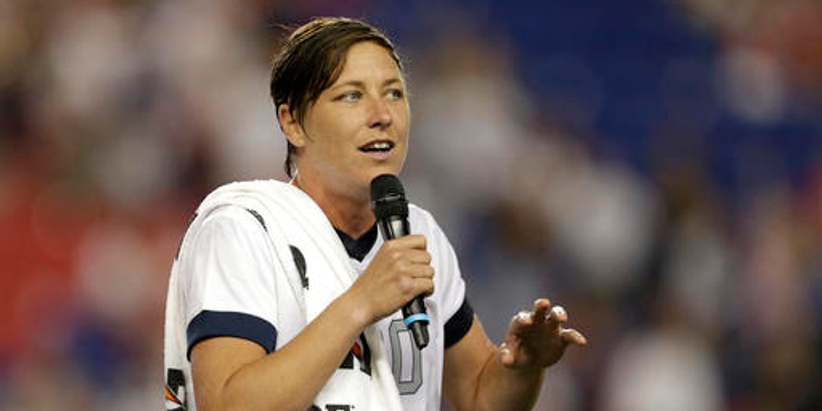 FILE - In this June 20, 2013 file photo, United States' Abby Wambach talks to spectators after an international friendly soccer match in Harrison, N.J. Retired U.S. national team star Abby Wambach is joining ESPN as an analyst and a contributor. Wambach, who is the leading international goal scorer of all time, will cover the European Championships in France and the Rio Olympics in August. But her role will not be limited to soccer: she’ll work across multiple platforms including ESPN Films and shows including “Outside the Lines,” the network said. (AP Photo/Julio Cortez, File)