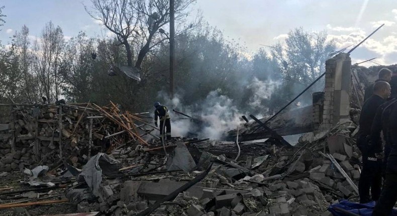 Rescuers work at a site of a Russian military strike, amid Russia's attack on Ukraine, in the village of Groza, in Kharkiv region, Ukraine in this handout image released on October 5, 2023.Kharkiv Regional Prosecutor's Office/Handout via REUTERS