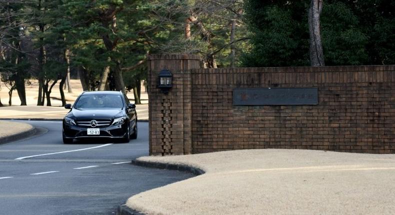 A car leaves the main entrance of the Kasumigaseki Country Club in Kawagoe, a suburb of Tokyo, on January 18, 2017