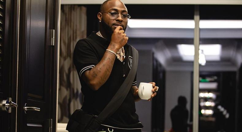 Davido wearing a Balmain polo [instagram/davido}