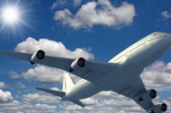 Airplane flying over a blue sky