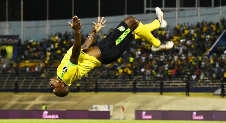 Jamaica's Dever Orgill celebrates his goal against Honduras with a somersault