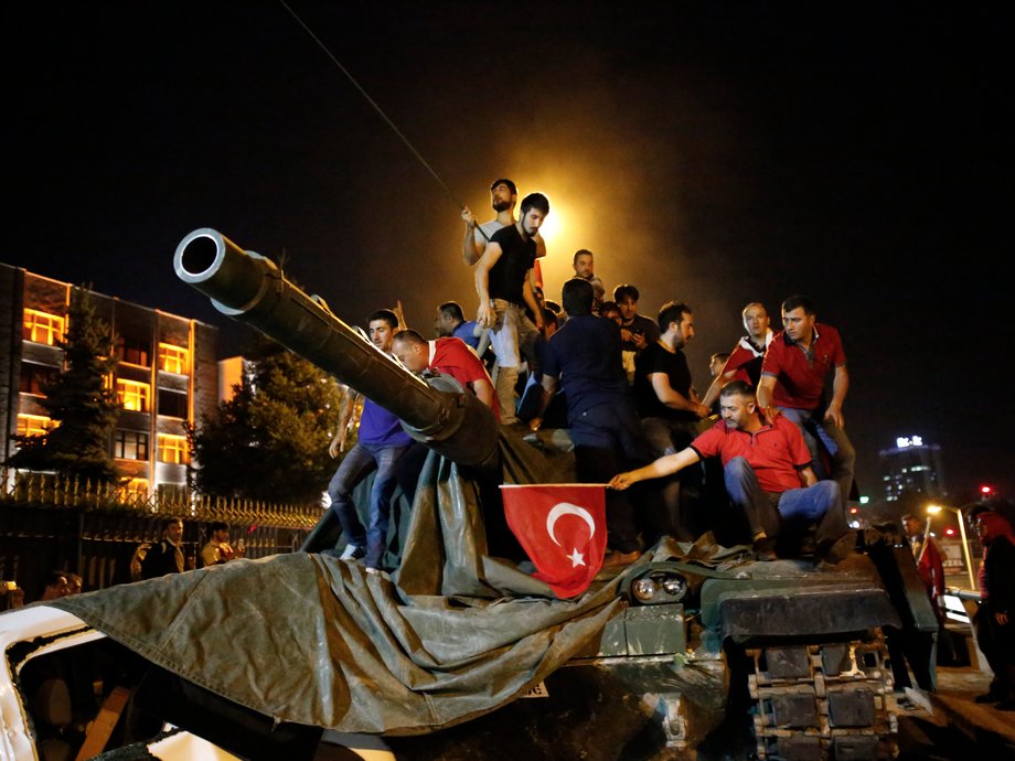 People stand on a Turkish army tank in Ankara on July 16.