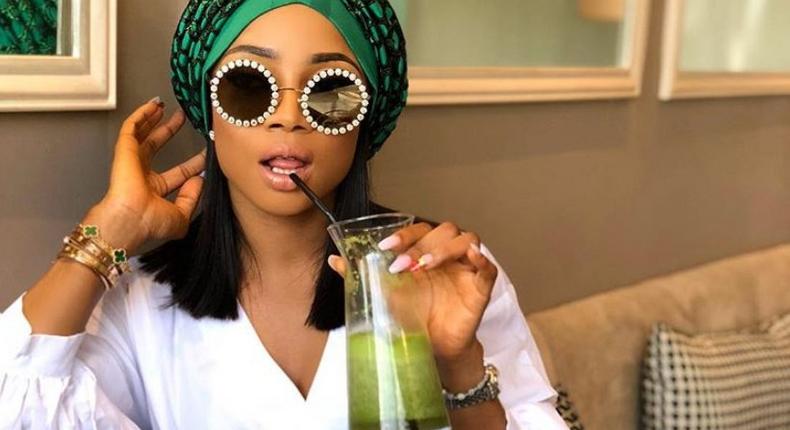 Toke Makinwa wears a stylish green turban from Turban Tempest