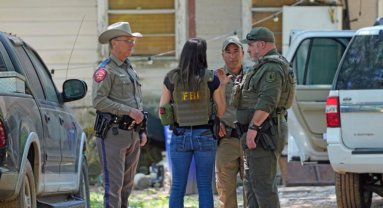 Law enforcement officials work Sunday, April 30, 2023, in the neighborhood where a mass shooting occurred Friday night, in Cleveland, Texas.AP Photo/David J. Phillip